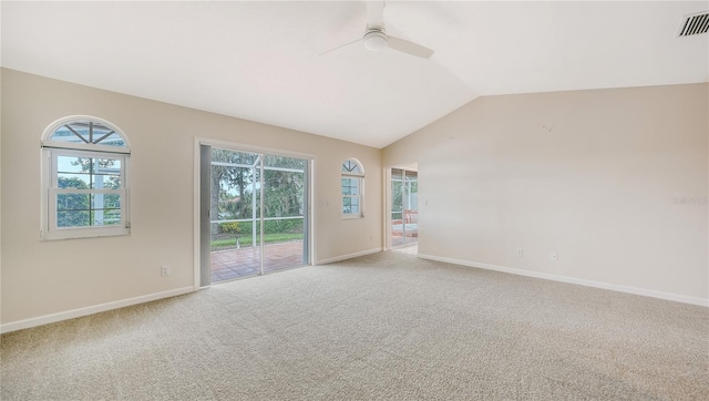 unfurnished room with carpet flooring, ceiling fan, plenty of natural light, and lofted ceiling