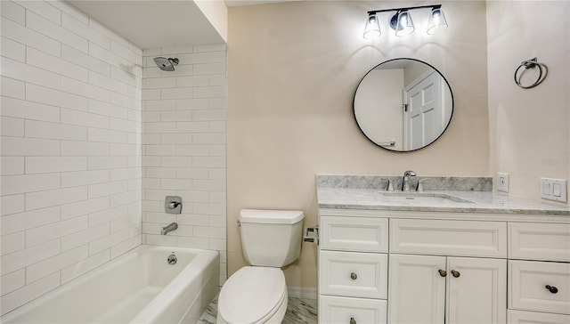 full bathroom featuring vanity, toilet, and tiled shower / bath