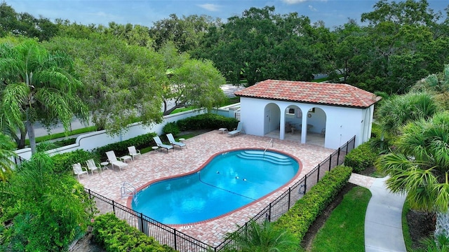 view of swimming pool featuring a patio