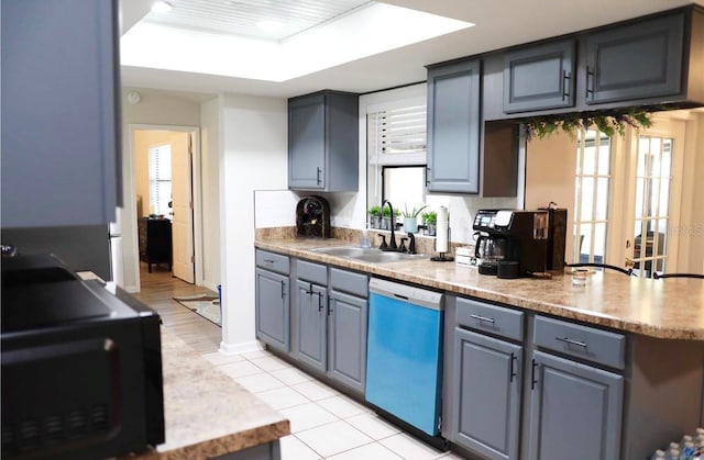 kitchen with decorative backsplash, stainless steel dishwasher, plenty of natural light, and sink