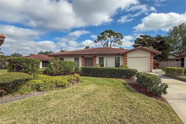 ranch-style home featuring a garage and a front lawn