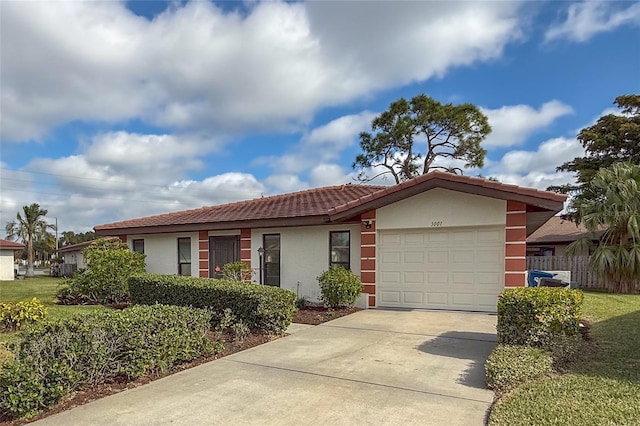 ranch-style home featuring a garage