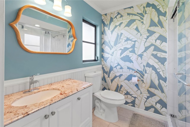 bathroom with walk in shower, tile patterned floors, toilet, vanity, and ornamental molding