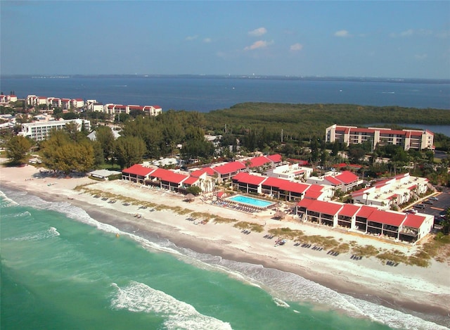 aerial view with a water view and a beach view