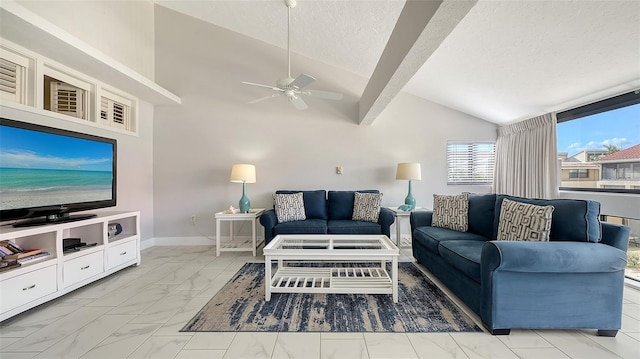 living room with a textured ceiling, lofted ceiling with beams, and ceiling fan