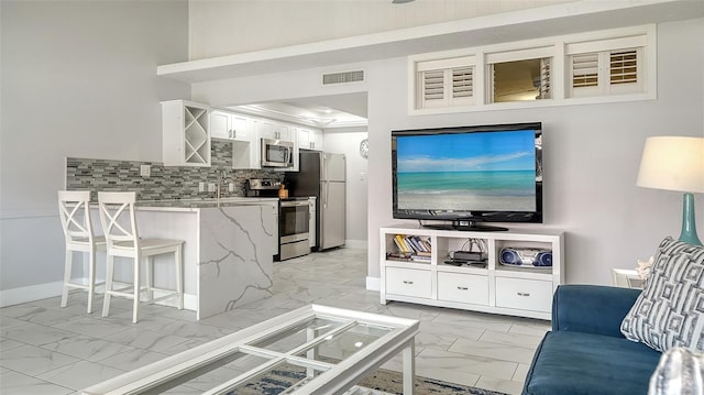 living room featuring sink