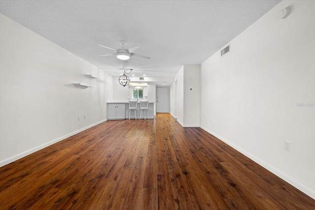 unfurnished living room with hardwood / wood-style floors and ceiling fan