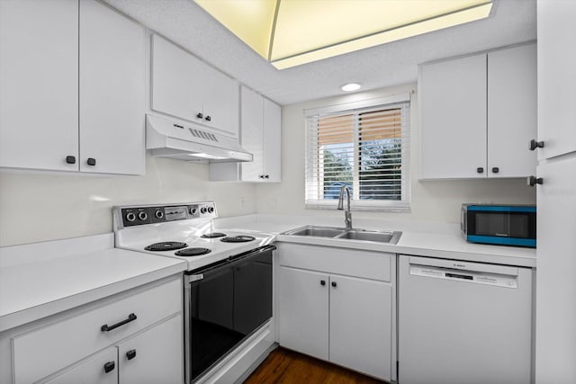 kitchen featuring dark hardwood / wood-style flooring, sink, white cabinets, and white appliances