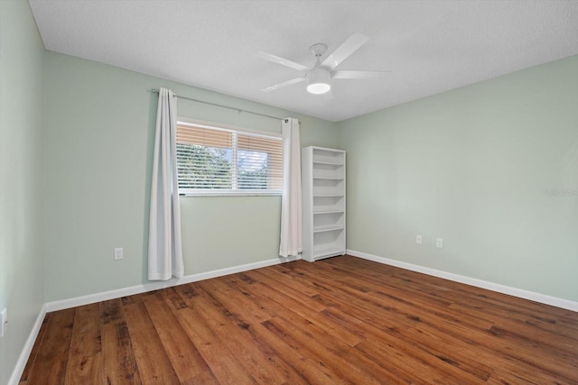 unfurnished room featuring hardwood / wood-style floors, a textured ceiling, and ceiling fan