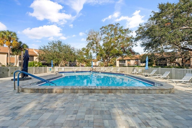 view of swimming pool featuring a patio area