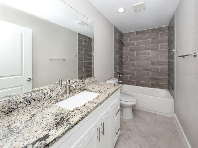 full bathroom featuring vanity, tiled shower / bath combo, and toilet