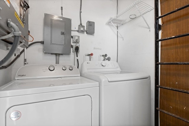 washroom featuring washer and clothes dryer and electric panel