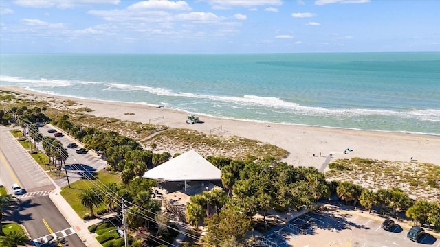 bird's eye view featuring a water view and a view of the beach