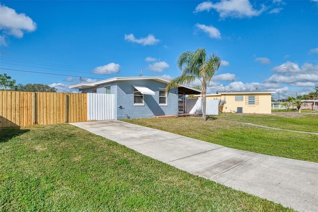 ranch-style house featuring cooling unit and a front lawn