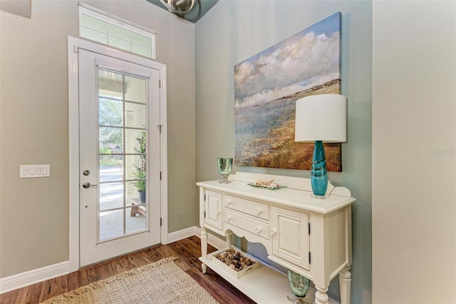 doorway featuring dark wood-type flooring