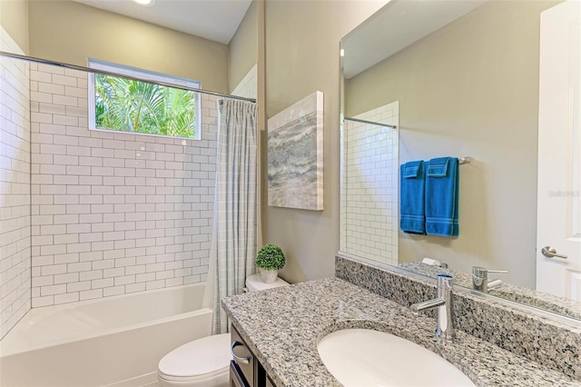 full bathroom featuring shower / bath combo, vanity, and toilet