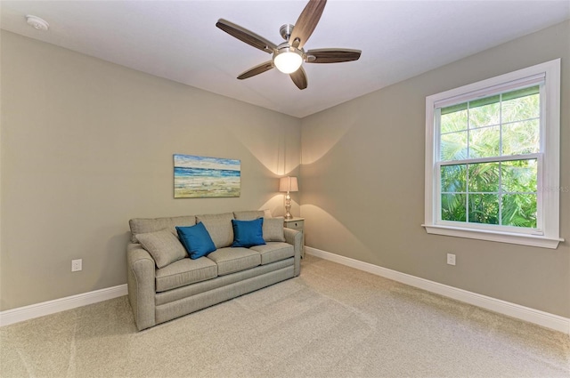 living room with carpet floors and ceiling fan