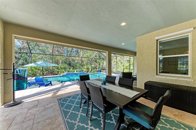 view of patio / terrace with a lanai and radiator heating unit