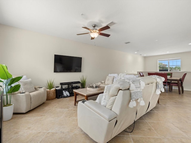 tiled living room with ceiling fan