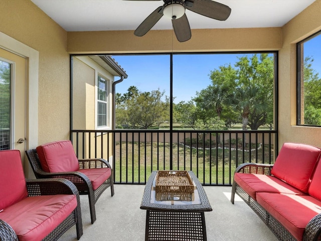 sunroom / solarium featuring ceiling fan