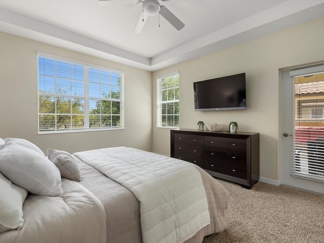 bedroom featuring ceiling fan and light carpet