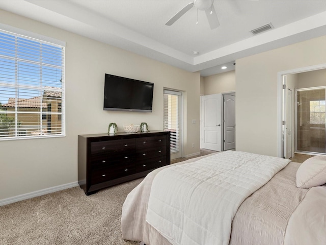 carpeted bedroom featuring ensuite bathroom and ceiling fan