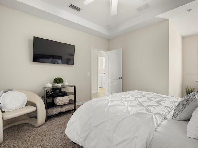 bedroom with carpet flooring, washer / clothes dryer, and ceiling fan