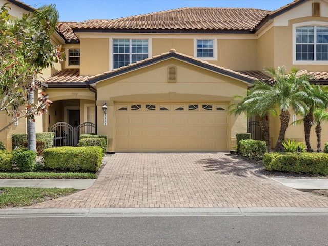 mediterranean / spanish-style house featuring a garage