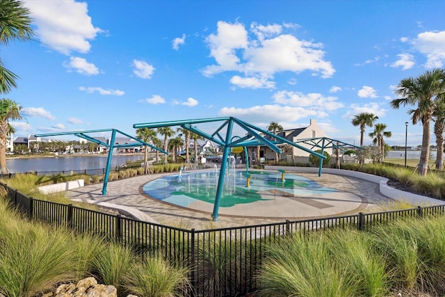 view of swimming pool featuring a water view