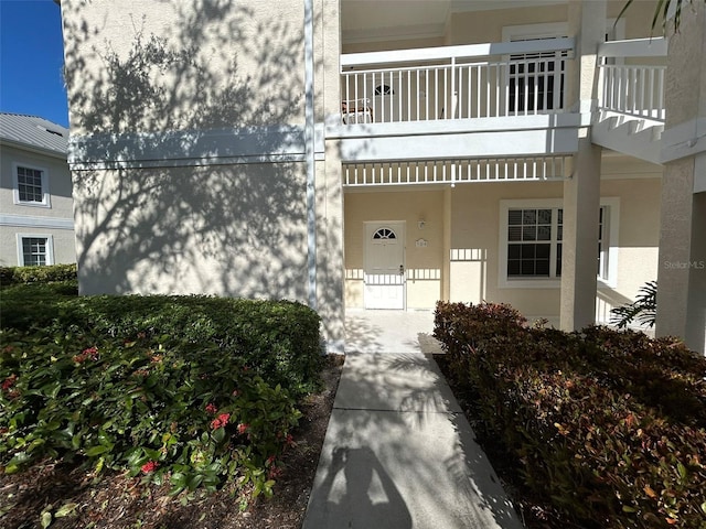 property entrance with a balcony