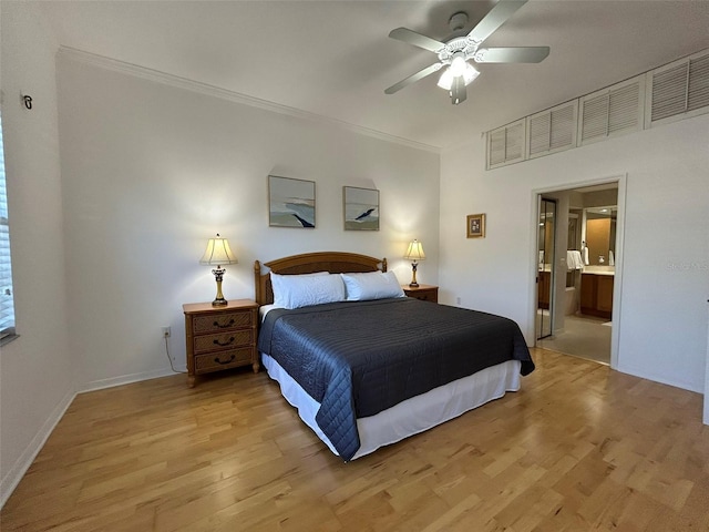 bedroom with ensuite bath, ceiling fan, ornamental molding, and light wood-type flooring