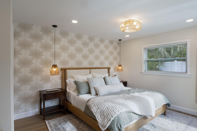 bedroom with hardwood / wood-style floors