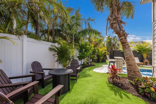 view of yard featuring a patio area and central AC