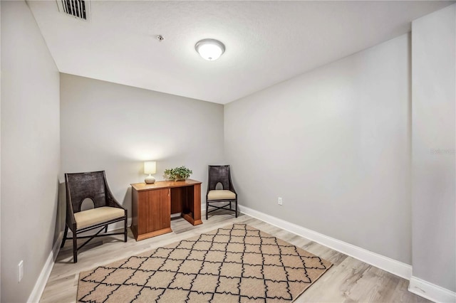 sitting room featuring light wood-type flooring