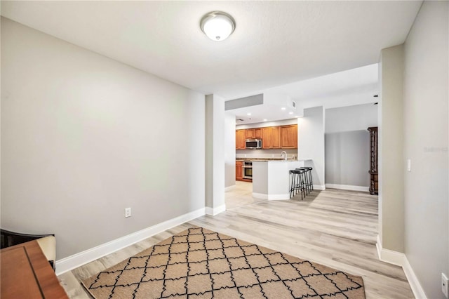 unfurnished living room featuring light hardwood / wood-style flooring