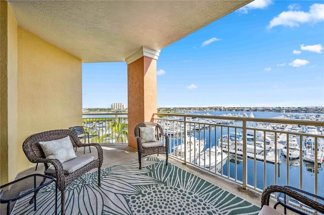 balcony featuring a water view