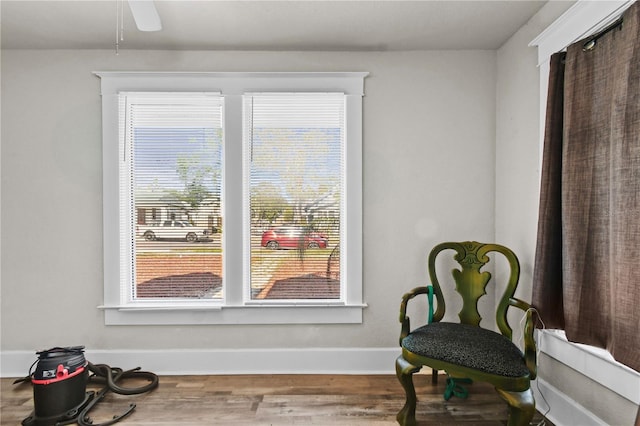 sitting room featuring ceiling fan, a healthy amount of sunlight, and hardwood / wood-style flooring