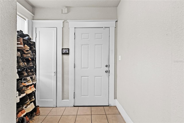 interior space with light tile patterned floors