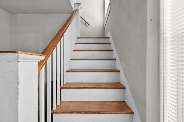 staircase featuring plenty of natural light