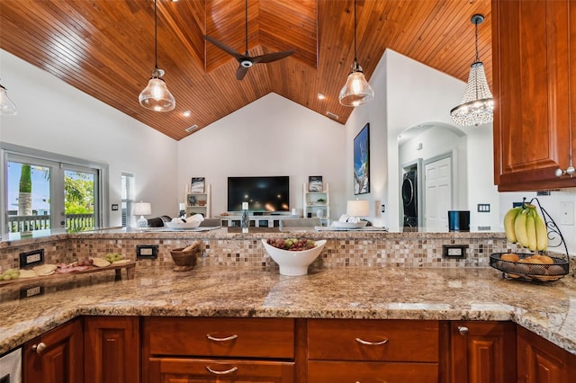 kitchen with light stone counters, ceiling fan, decorative light fixtures, high vaulted ceiling, and wooden ceiling