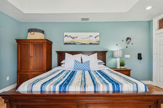 bedroom with light hardwood / wood-style floors