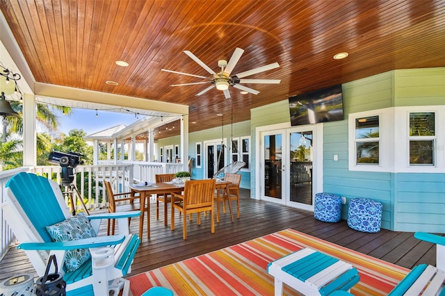 wooden terrace featuring ceiling fan and french doors