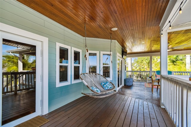 wooden terrace featuring a porch