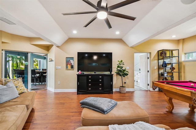 living room featuring hardwood / wood-style flooring, lofted ceiling, and a wealth of natural light