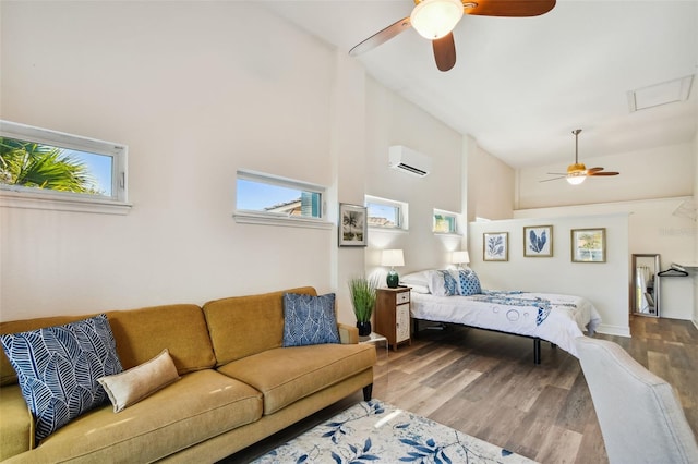 bedroom with multiple windows, high vaulted ceiling, a wall mounted air conditioner, and hardwood / wood-style flooring