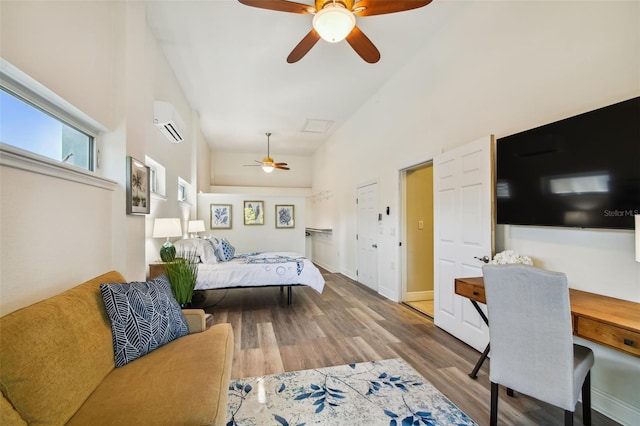 bedroom with hardwood / wood-style floors, ceiling fan, high vaulted ceiling, and a wall mounted AC