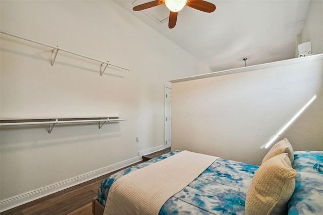 bedroom with a closet, hardwood / wood-style flooring, vaulted ceiling, and ceiling fan