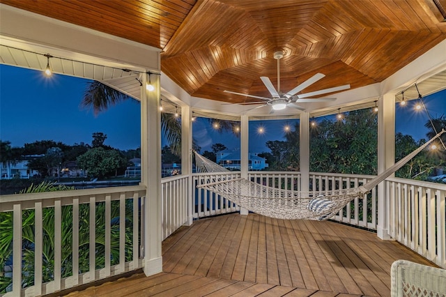 deck at twilight with ceiling fan