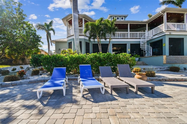 view of patio featuring a balcony