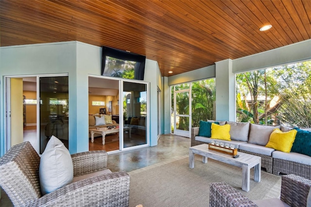 sunroom with wooden ceiling